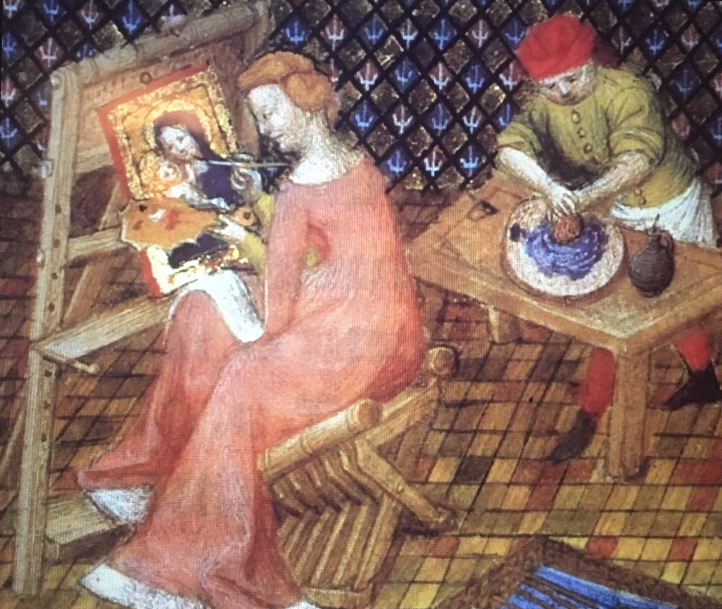 Medieval artist with apprentice preparing paint